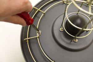 Screw on the new larger cage.