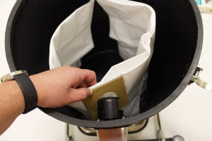 Slide the cardboard head/rubber seal over the coupling